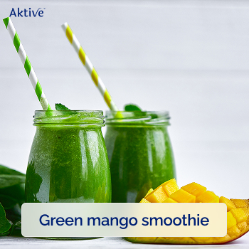 Two glasses with green mango smoothie