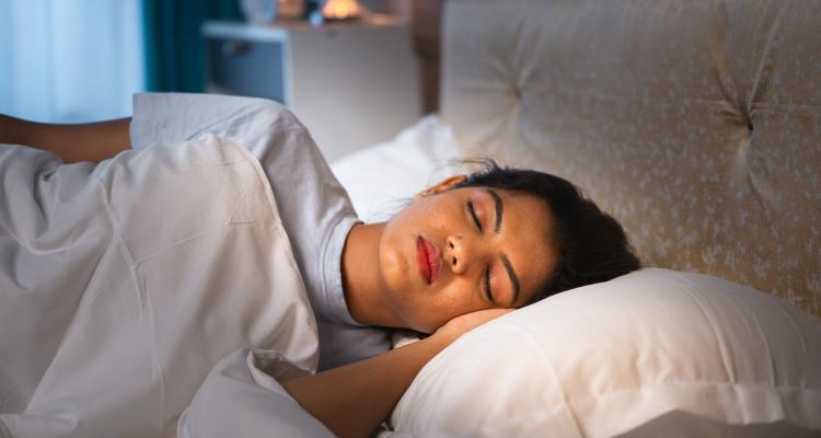 Indian woman sleeping soundly on bed