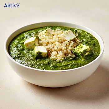Palak paneer and quinoa in a bowl